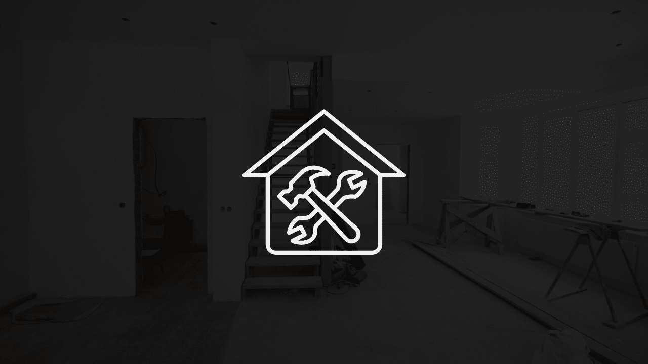 A dark, minimalist interior photograph of a residential house under construction overlaid with a white vector icon of a house containing crossed tools, representing a guide on how to market a home renovation business: the definitive local growth strategy.
